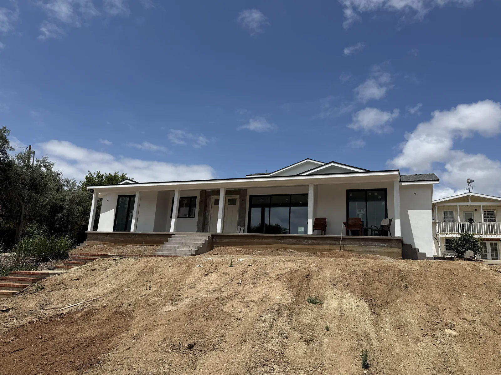 Finished stucco on the front elevation and porch of a Bonita home by Maya Stucco Inc.