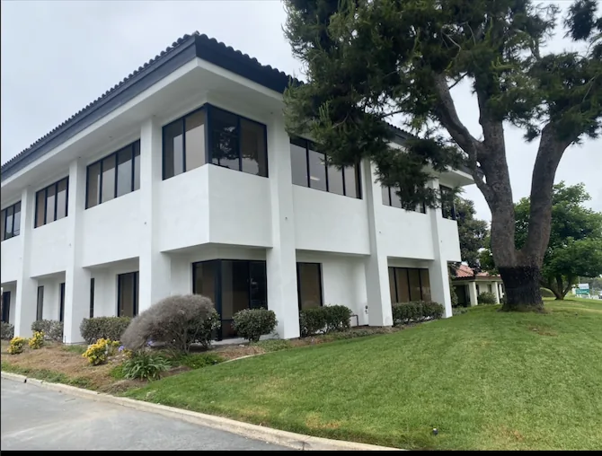 Smooth white stucco finish on a Carlsbad commercial office building by Maya Stucco Inc.