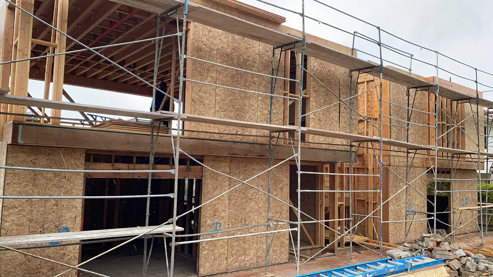Bare OSB sheathing and framing on a La Jolla home before lath and plaster work began