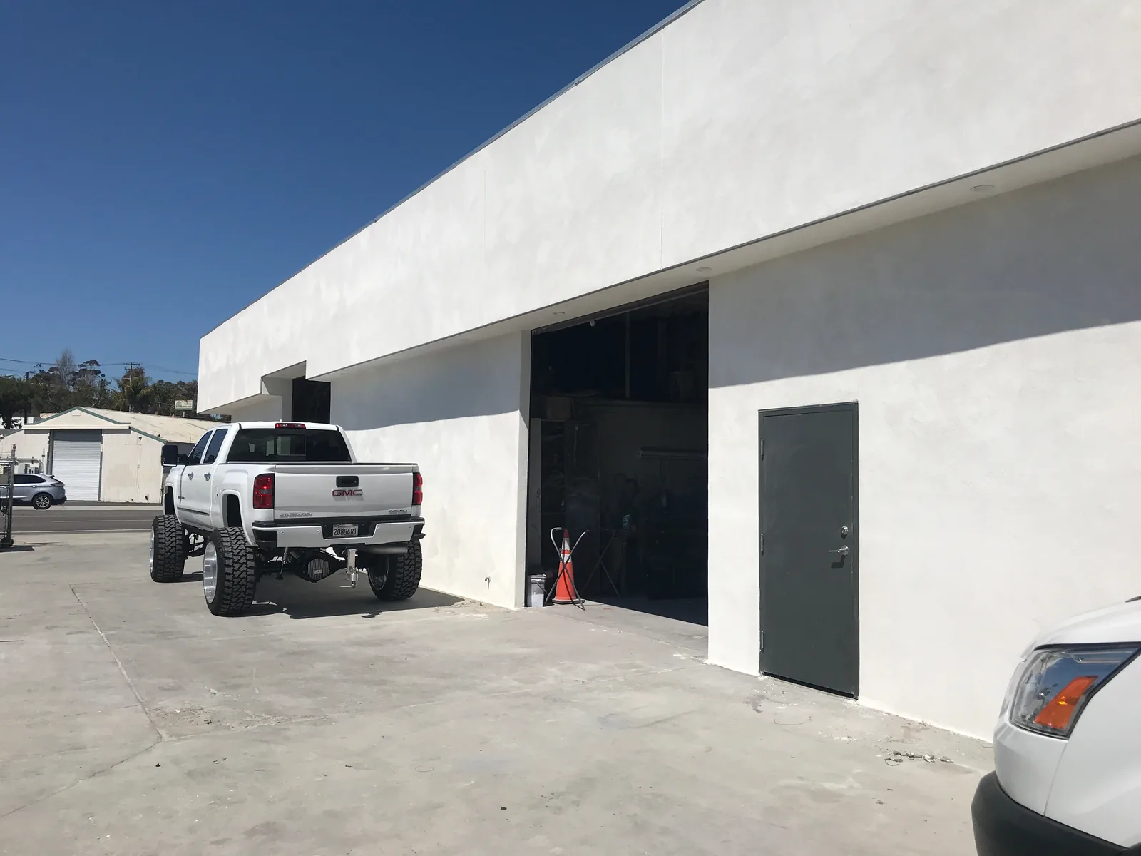 Close detail of smooth finish coat on a commercial stucco wall in Oceanside